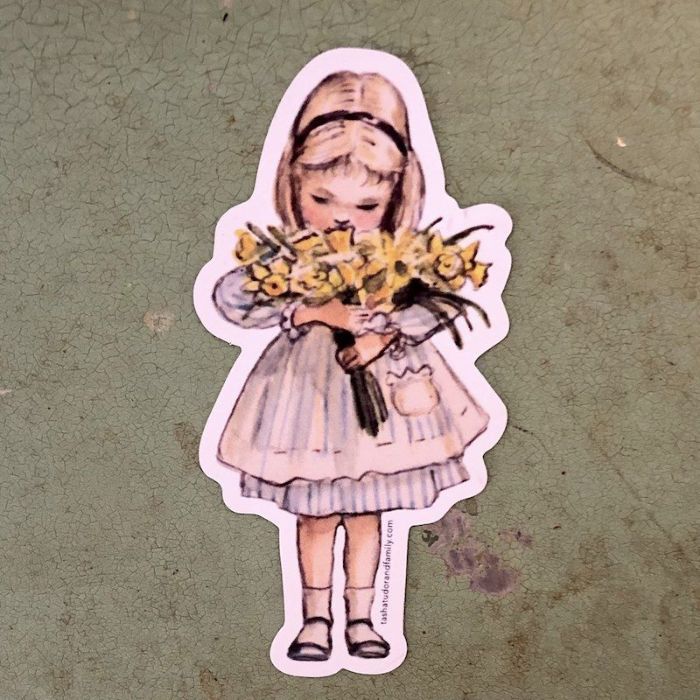 Child with Daffodils Sticker or Magnet